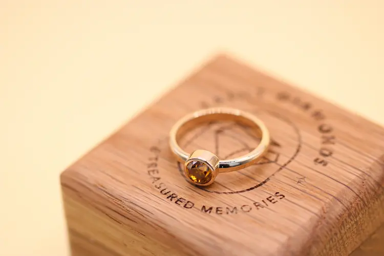 Memorial diamond ring on a ring box