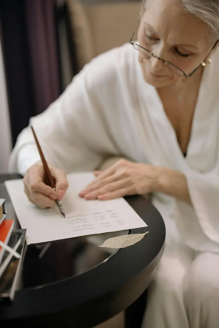 A woman writing a condolences letter